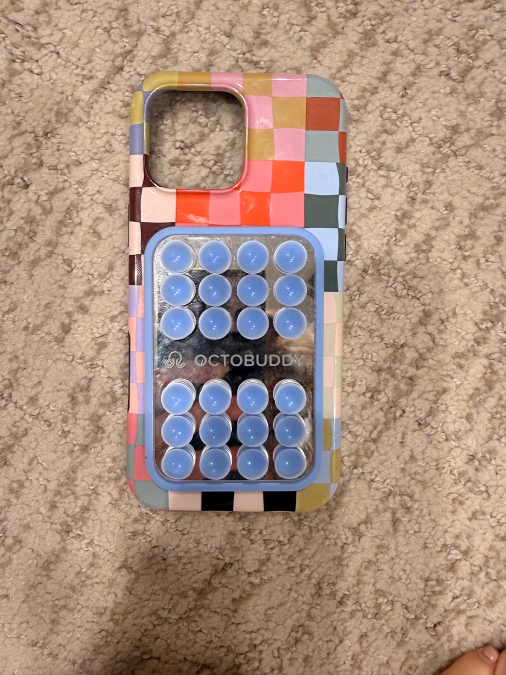 Checkered iPhone 16 pro max case with attached mirrored octobuddy